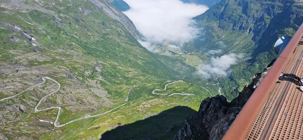 Aerial view of mountain valley with winding road and fjord