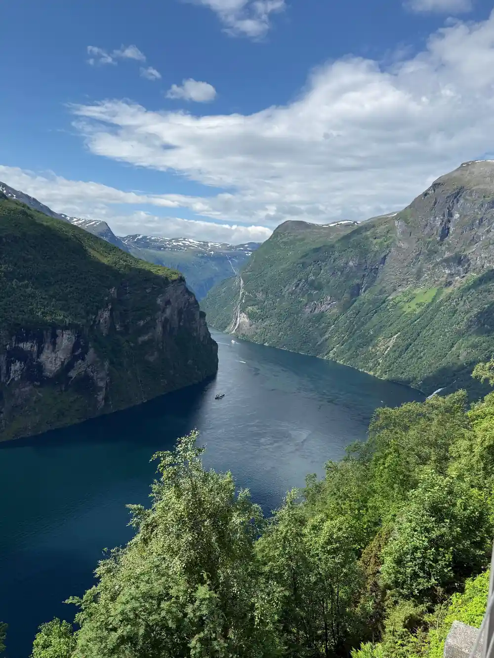 Deep green valley with waterfall and steep cliff faces