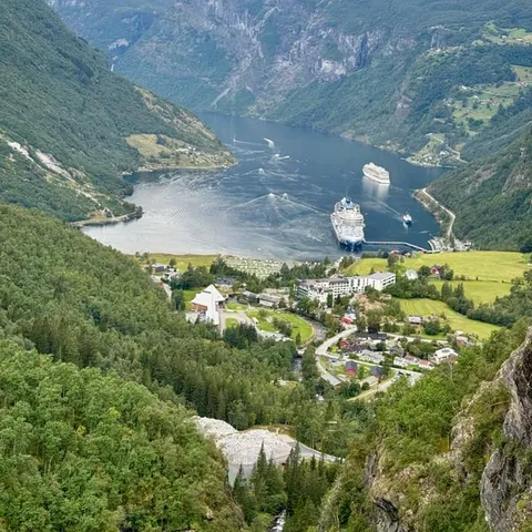 Geiranger village with cruise ships in the fjord below