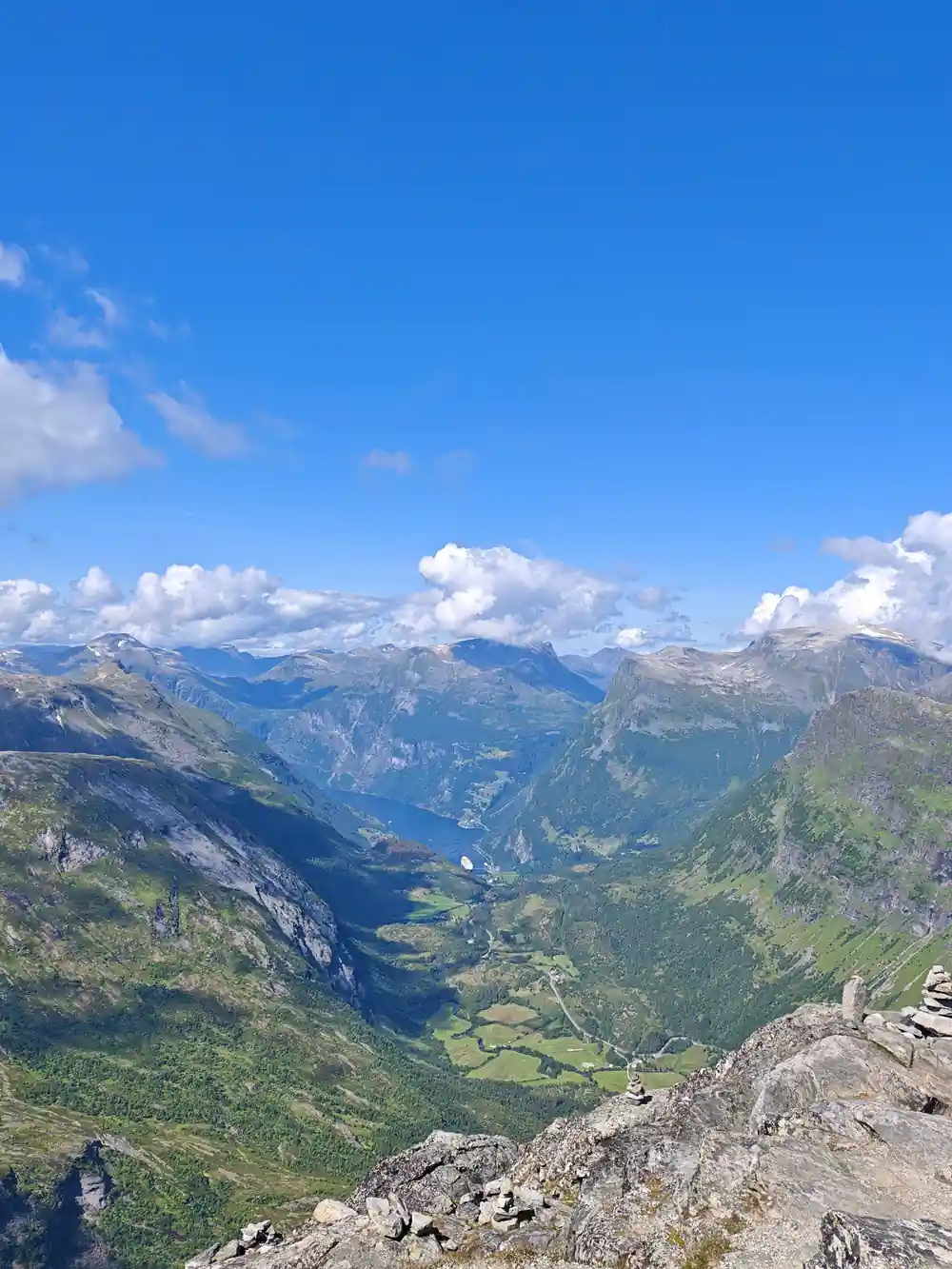 Mountain valley with deep blue fjord from high viewpoint