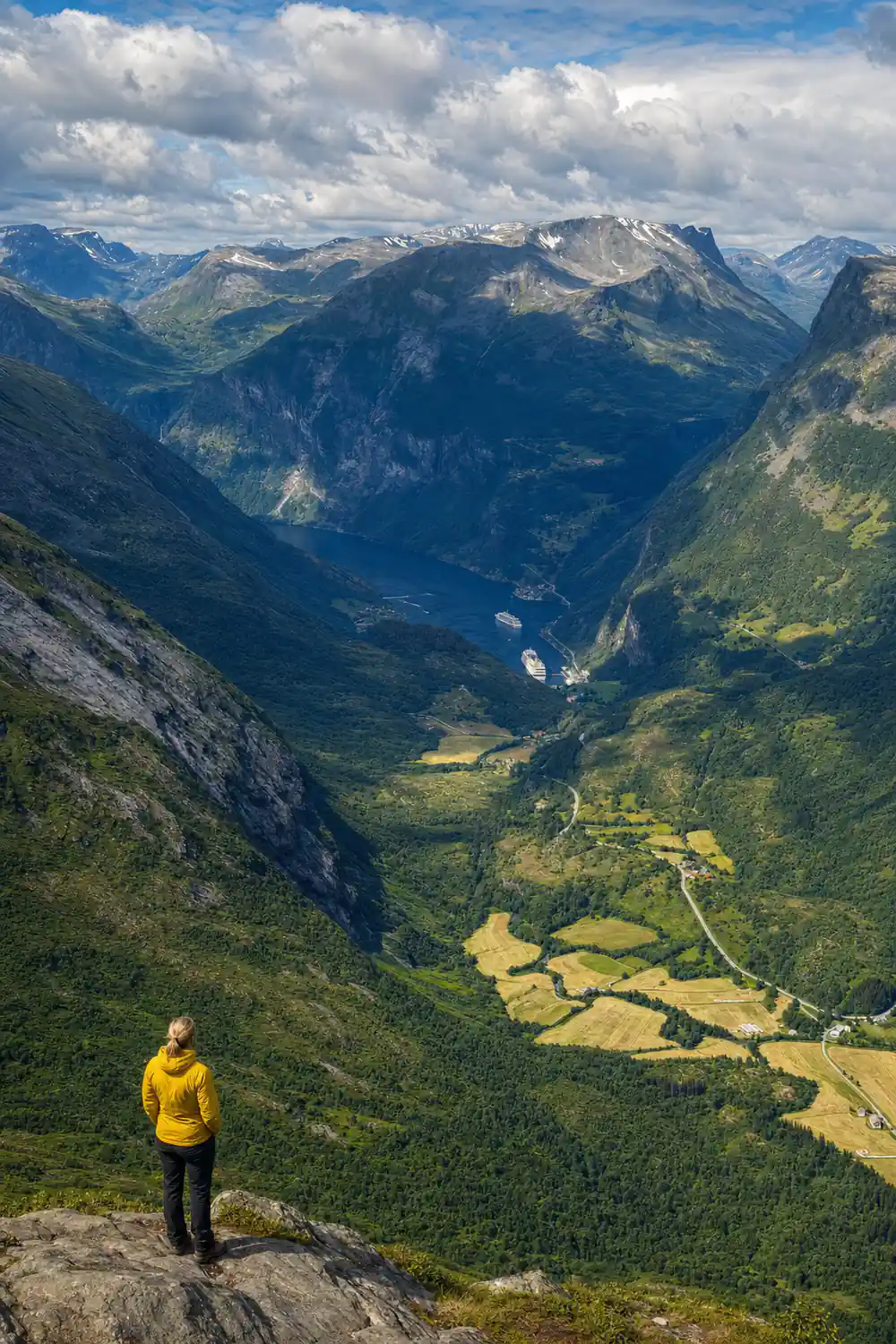 Mountain valley with river and forested slopes below