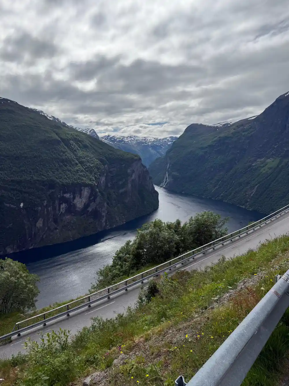 River flowing through deep valley with steep rocky cliffs and road